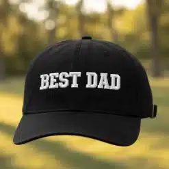 Black low‑profile cotton dad hat with BEST DAD text and metal buckle closure, one size 55–60 cm